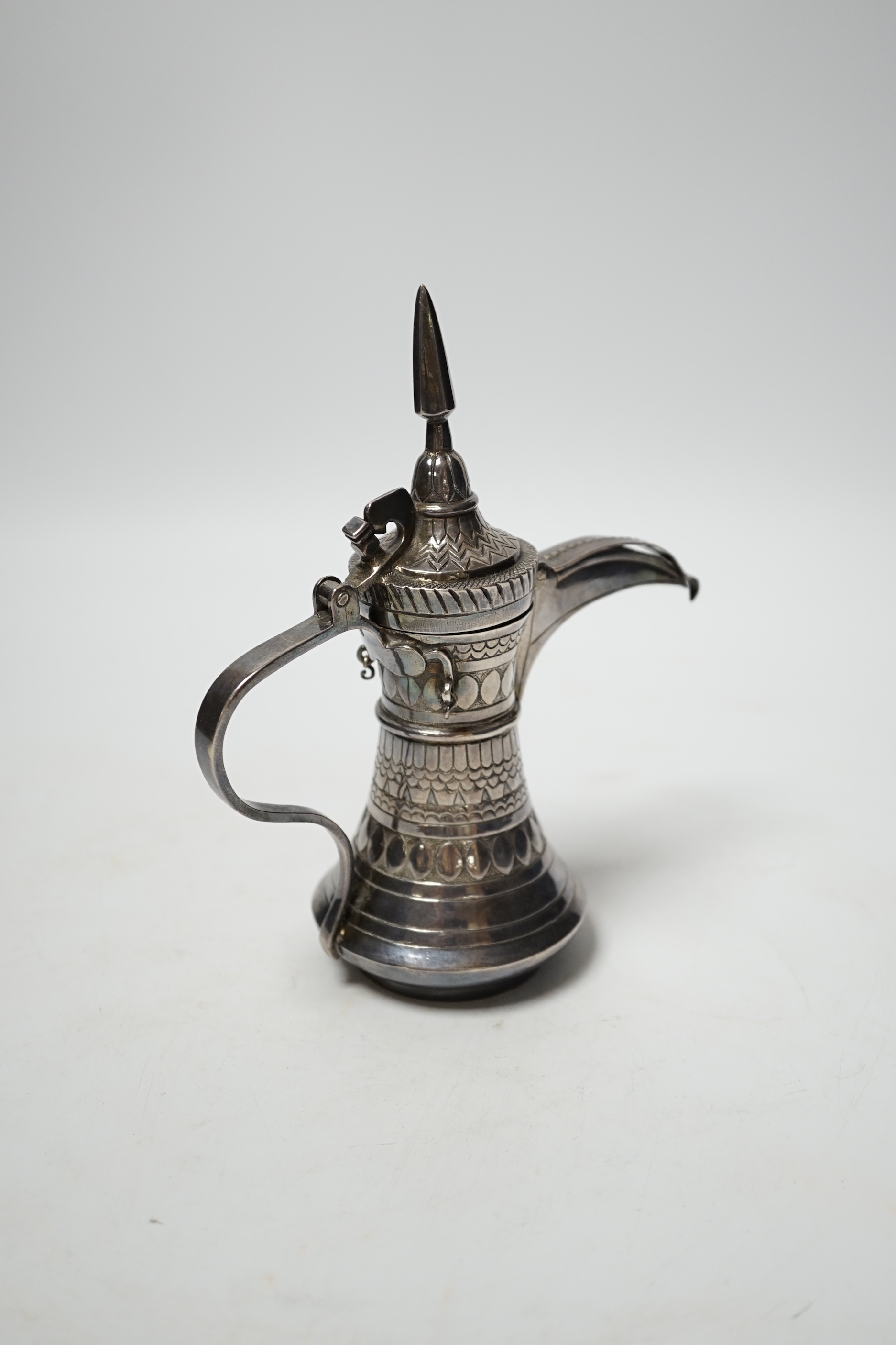 A small Persian white metal dallah, 16cm